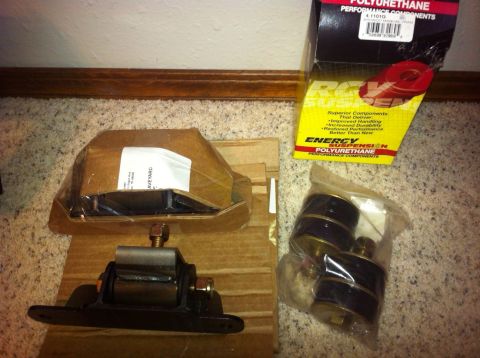 1982 Ford Bronco - New engine mounts and polyurethane bushings are laid out on the floor.
