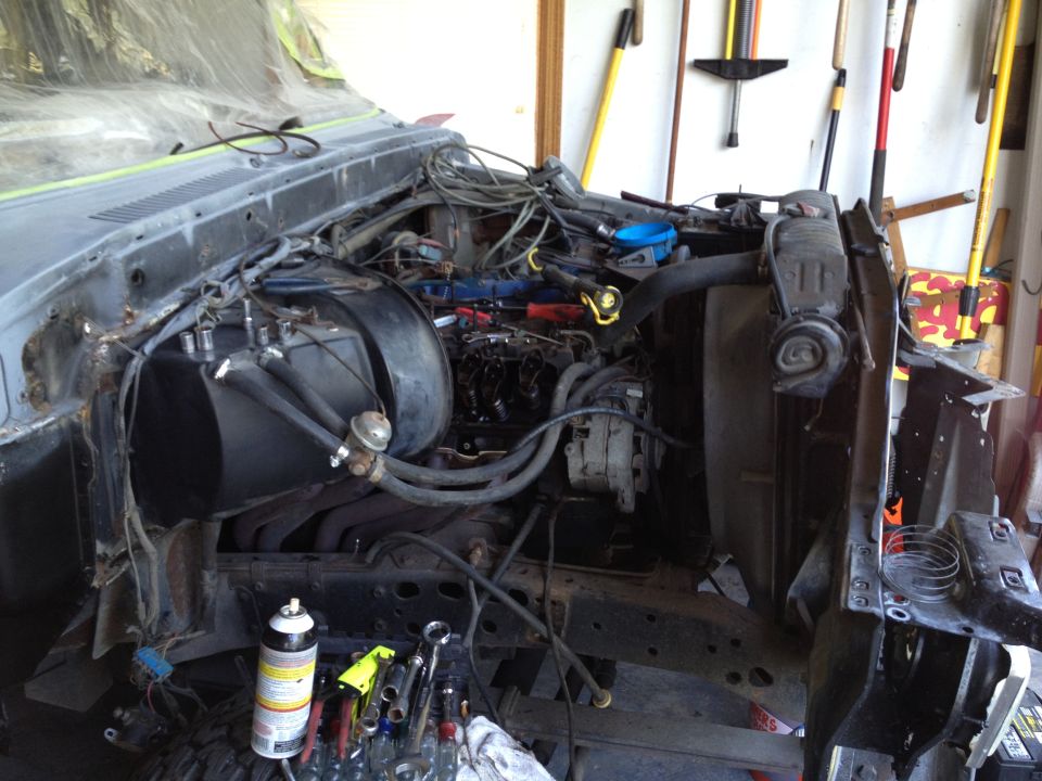 1979 Ford F-350 engine bay with parts removed for work