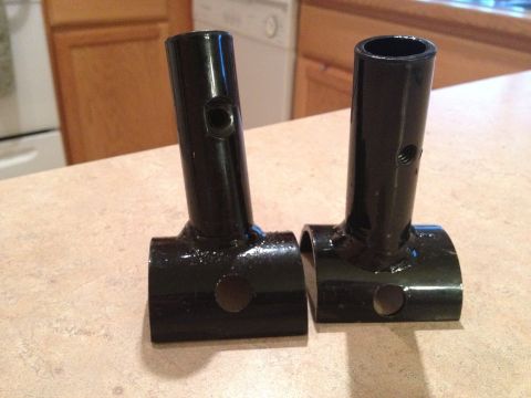2005 Jeep Wrangler - Two black metal brackets are shown on a countertop, with a kitchen in the background.