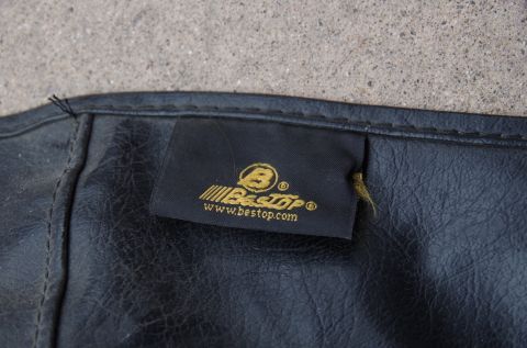 1983 Ferrari Enzo - Close-up of a black soft top a Bestop brand label with their website address visible.