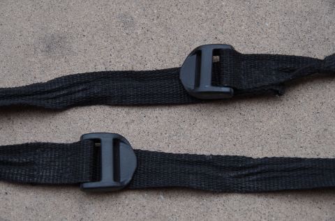 1983 Ferrari Enzo - Close-up of two black straps with plastic buckles, likely for securing cargo or a cover.