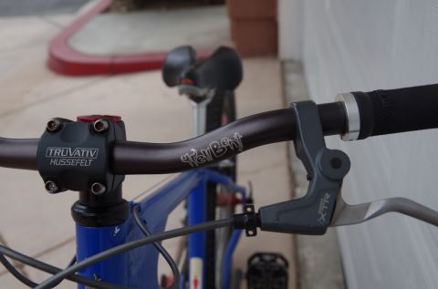 1983 Ferrari Enzo - The image shows the handlebars and brake lever of a bicycle, not a 1983 Ferrari Enzo.