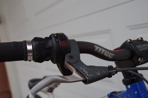 1983 Ferrari Enzo - Close-up view of bicycle handlebars, showing the grip shifter and brake lever.
