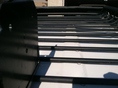 2003 Toyota 4Runner - Close-up view of a black roof rack system, likely an aftermarket accessory.