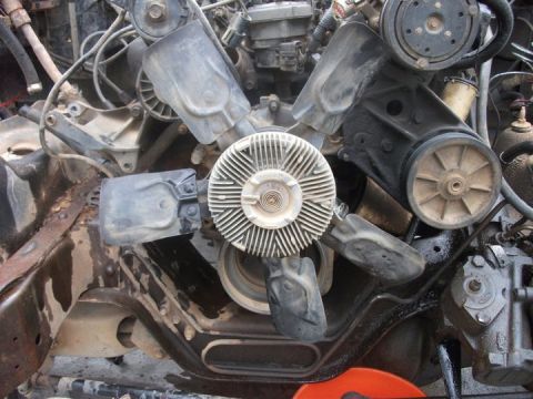 1990 Ford Bronco - Engine components including fan and pulleys are visible in this close-up view.