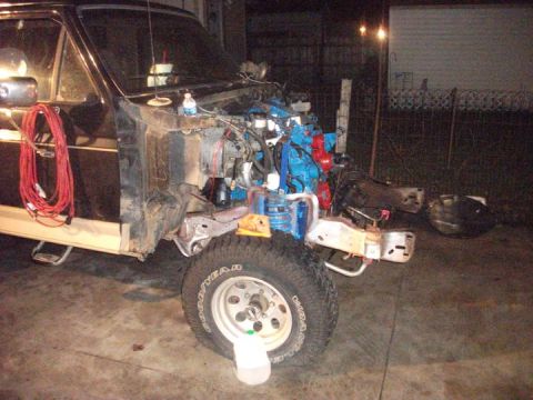 1990 Ford Bronco - 1990 Ford Bronco engine bay during a 4BTA swap, with engine components visible.