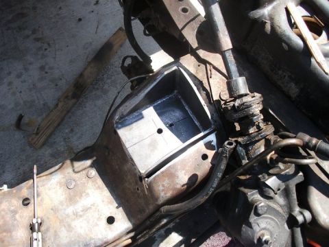 1990 Ford Bronco - Custom metal fabrication in the engine bay, likely for an engine swap, with visible steering components.