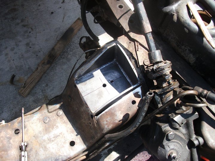 Engine bay modification with custom metal box and steering components