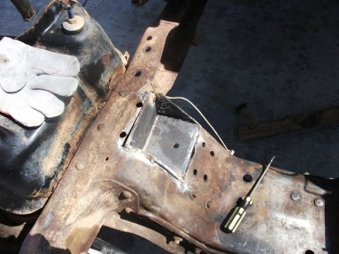 1990 Ford Bronco - Welding a custom bracket onto a rusty chassis, likely for an engine swap.