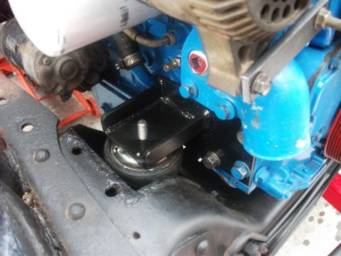 1990 Ford Bronco - A custom bracket is installed to mount the engine within the vehicle's chassis.