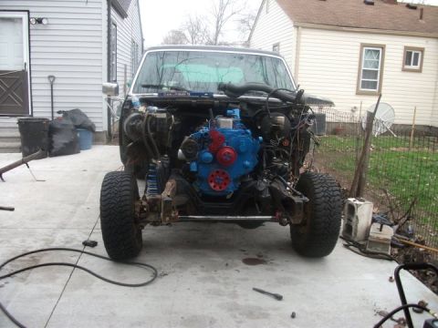 1990 Ford Bronco - This Ford Bronco is undergoing an engine swap, with the original engine removed and the bay exposed.