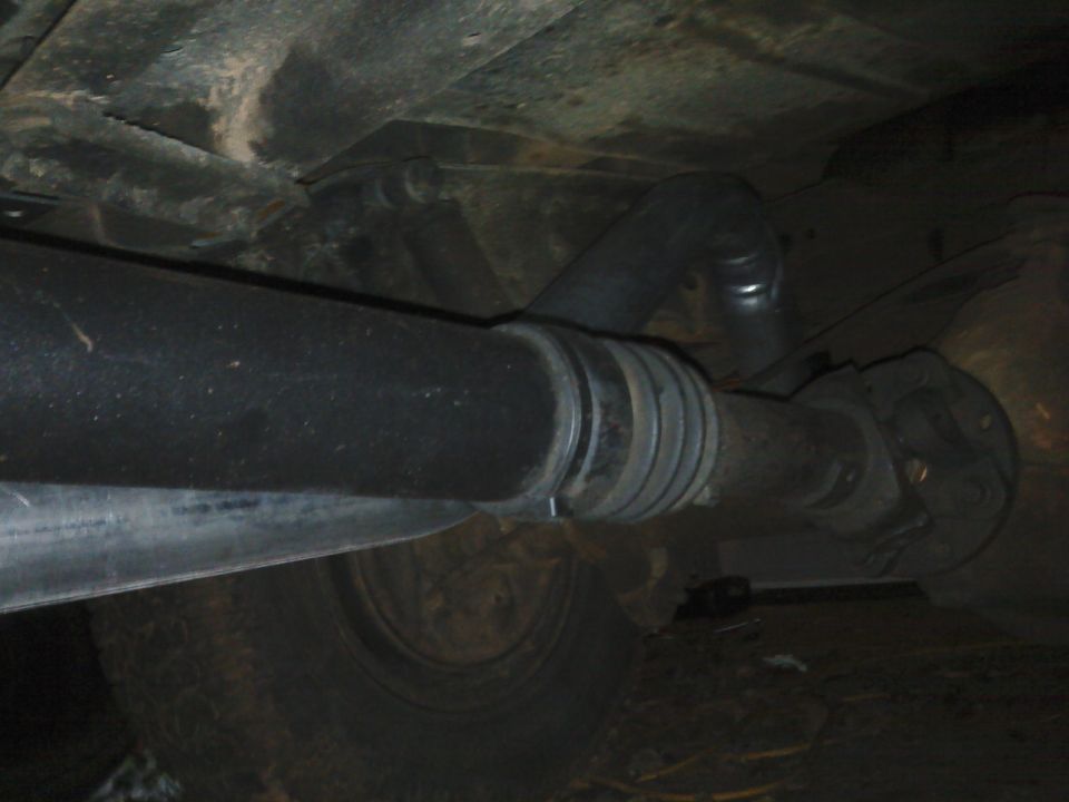 Close-up of a vehicle's driveshaft and U-joint