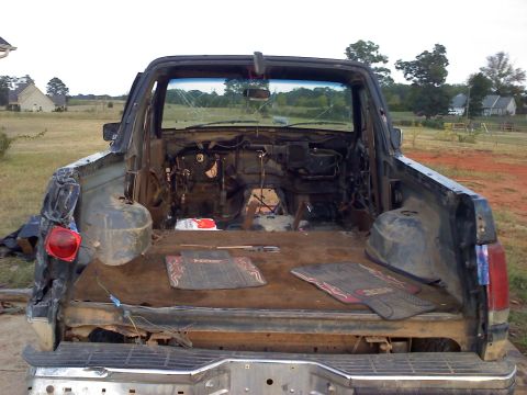1995 Ford Bronco - This heavily damaged 1992 Ford Bronco has had its interior components removed, leaving the chassis exposed.