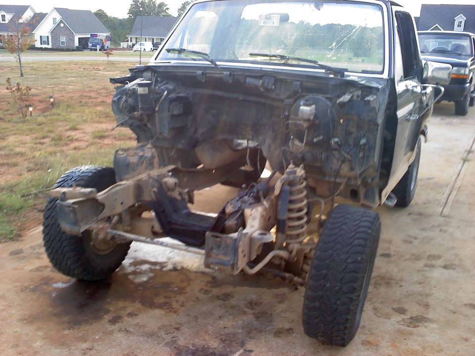 Disassembled truck front end, black, with visible SuperMotors.net logo