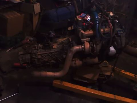 1995 Ford Bronco - An engine and transmission assembly is shown, likely removed from a vehicle for repair or replacement.