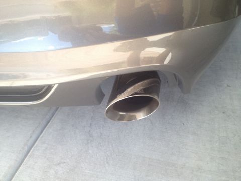 2013 Ford Mustang - Aftermarket exhaust tip with carbon fiber wrap.