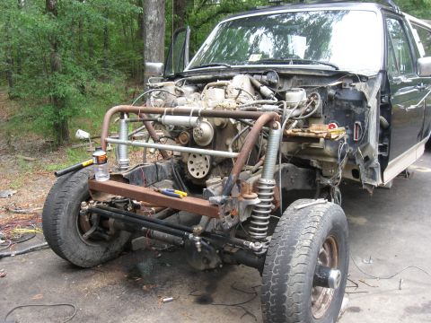 1990 Ford Bronco - This Ford Bronco is undergoing significant modifications with its front end disassembled and custom fabrication underway.
