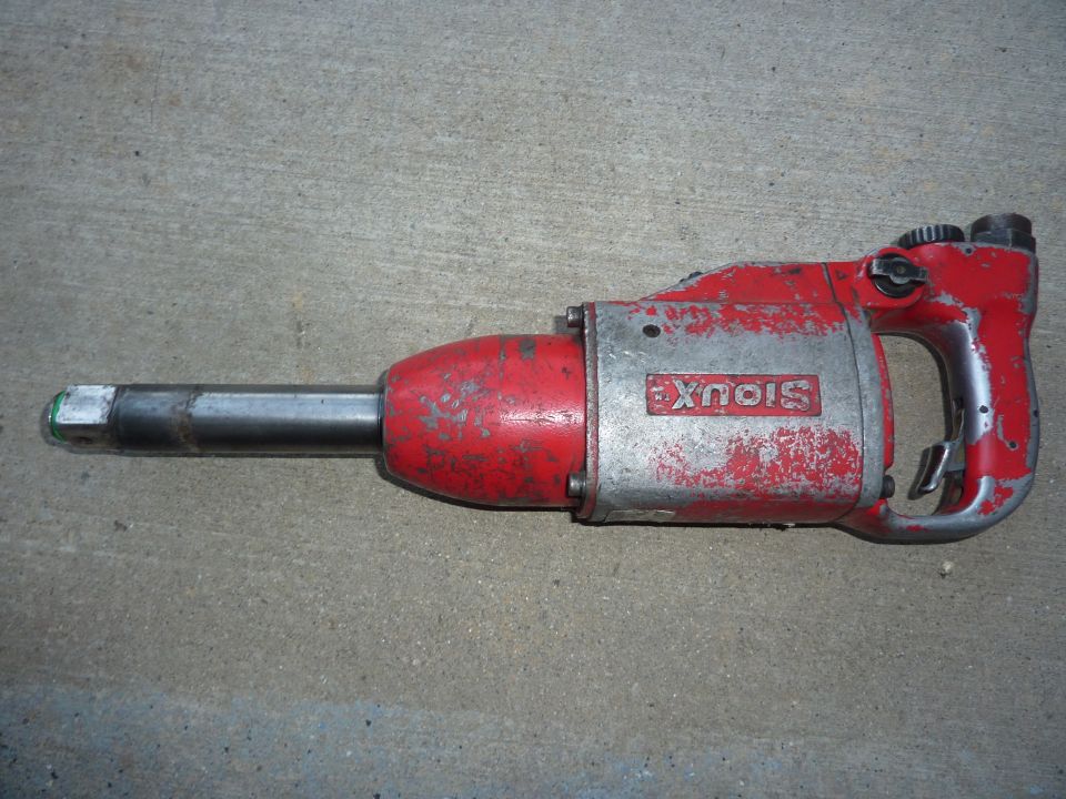 Red and silver Sioux impact wrench on concrete