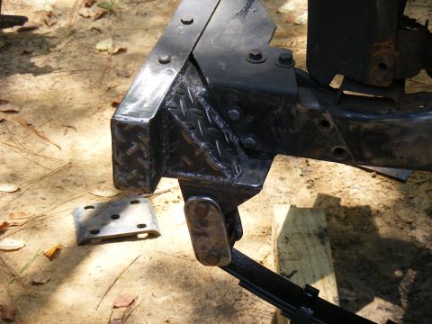 1978 Ford Bronco - Close-up of a modified vehicle frame, showing custom metalwork and suspension components.