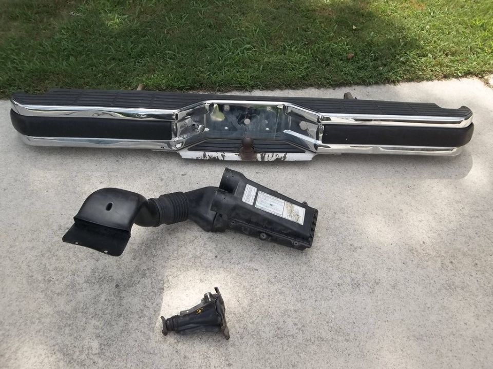 Rear bumper and air intake assembly removed from a vehicle