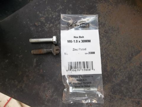 1995 Ford Bronco - A new hex bolt and a rusty one are shown next to a package of M6-1.0 x 30MM zinc-plated hex bolts.