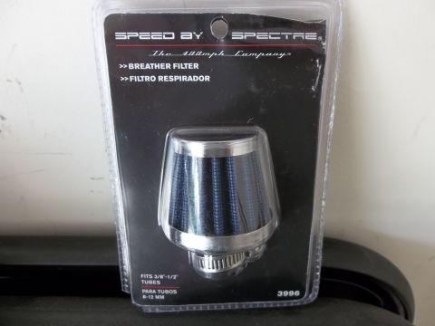 1995 Ford Bronco - A new Spectre breather filter is shown in its retail packaging, ready for installation.