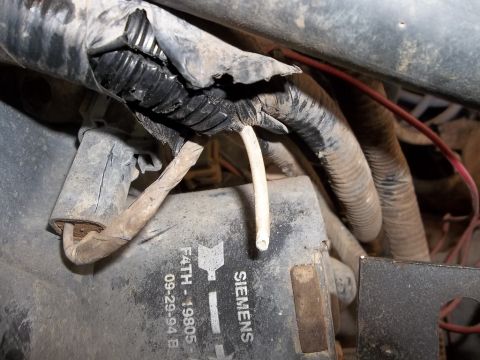 1995 Ford Bronco - Close-up of damaged wiring and a Siemens component with a date stamp of 09-29-94.