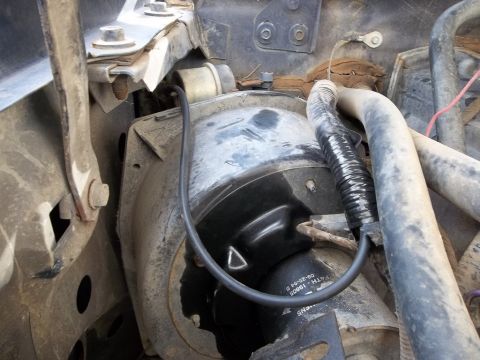 1995 Ford Bronco - Blower motor assembly with visible part number and date code.