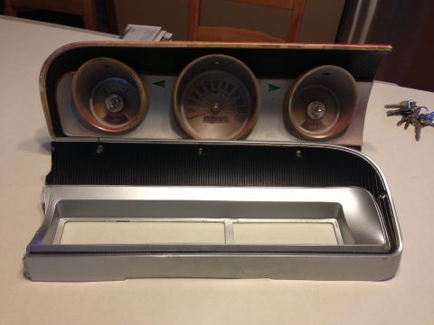 1964 Ford Fairlane - Instrument cluster from a 1964 Ford Fairlane, showing gauges and trim pieces.