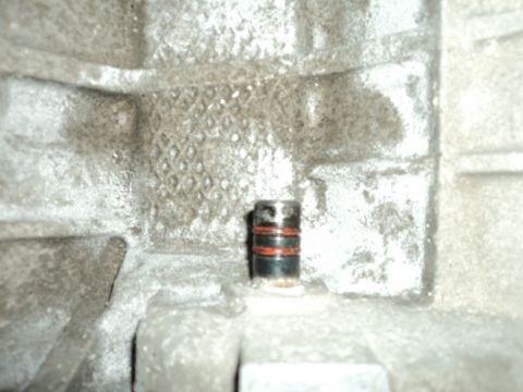 2004 Mercury Grand Marquis - Close-up of a transmission housing plug, likely part of a Marauder Eaton swap.