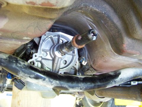 1999 Mercury Grand Marquis - Close-up of the driveshaft and transmission assembly, showing mechanical components from underneath the vehicle.