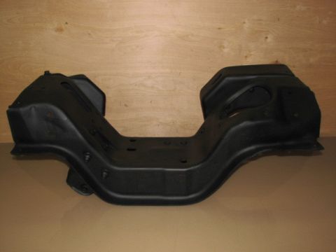 1995 Ford Bronco - A black metal engine crossmember is shown against a wood-paneled background.