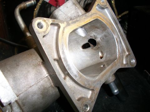 2001 Ford Crown Victoria - This throttle body shows significant internal damage and a cracked housing, indicating a potential failure.