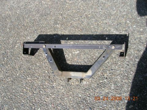 1995 Ford Bronco - A metal crossmember part is shown on a gravel surface, with a timestamp in the corner.
