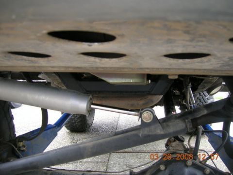 1995 Ford Bronco - The underside of a vehicle shows a large shock absorber and suspension components, with a date stamp of 03-26-2008.