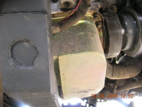 1995 Ford Bronco - Close-up view of engine components and a gray metal part, dated 03.26.2008.