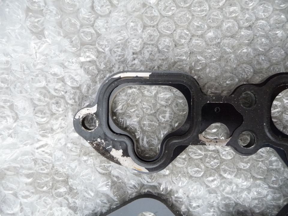 Outlaw thermal spacer overlaid with a used KL-ZE inlet manifold gasket