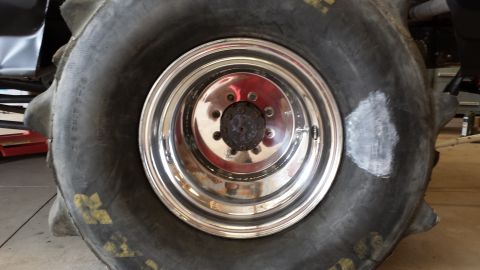 1995 Ford Bronco - A close-up view of a large tire and its chrome wheel, likely from a modified vehicle.