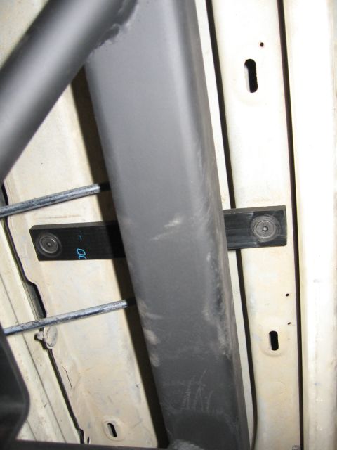 1993 Toyota 4Runner - Close-up view of a custom rear bumper build-up, showing mounting hardware and some faint text on a bracket.