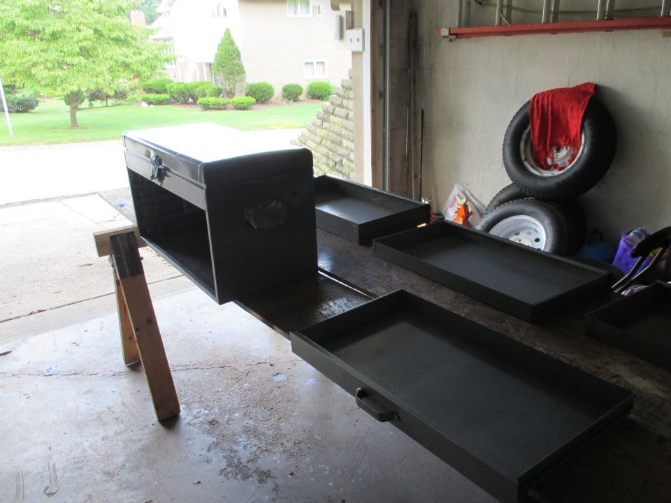 Machinist tool chest with drawers removed on sawhorses in a garage