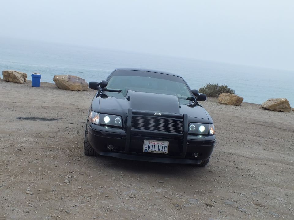 Black 'EVIL VIC' Crown Victoria front view with push bar at coastal pullout