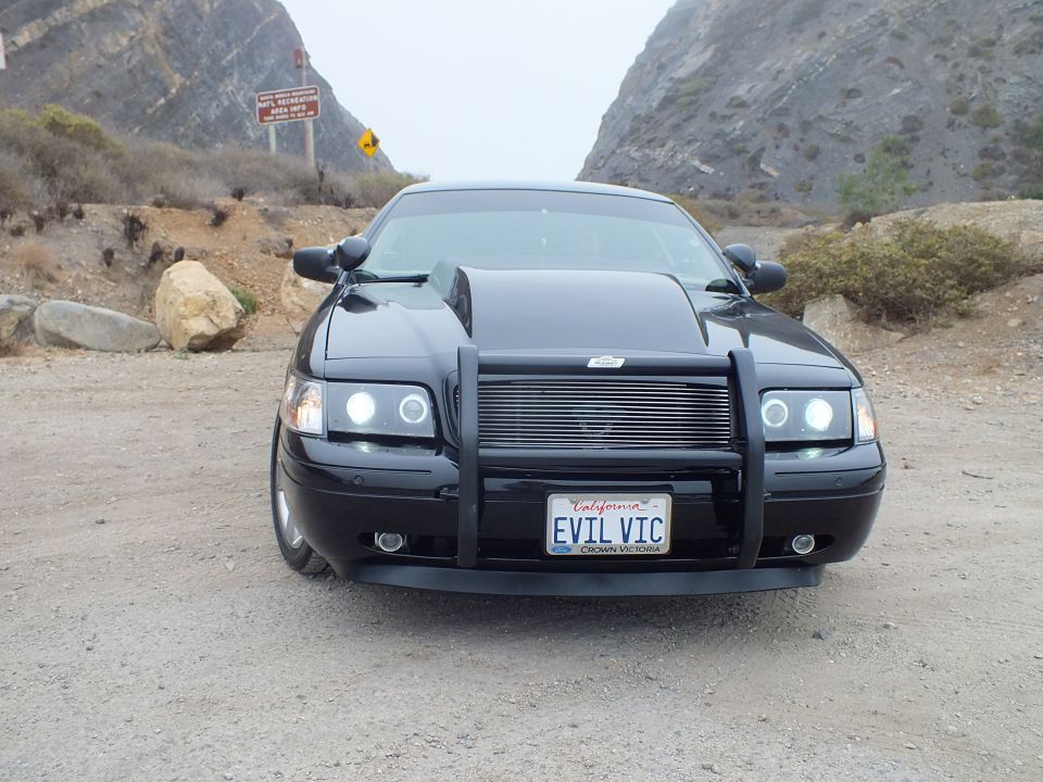 Black 'EVIL VIC' Crown Victoria head-on view at mountain pullout