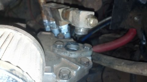1990 Ford Bronco - This is a close-up view of a vehicle's fuel injection system, showing various metal parts and hoses.