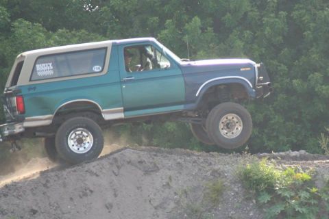 1996 Ford Bronco - This 1996 Ford Bronco is captured mid-air while navigating an off-road course.