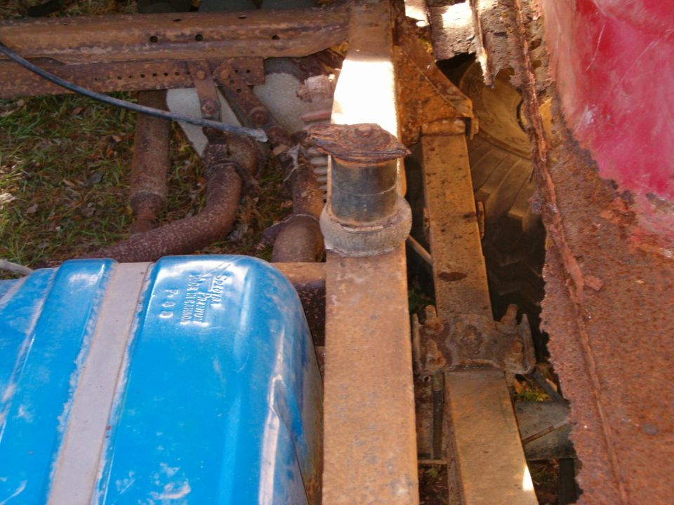 Passenger rear body mount, rusted through body.