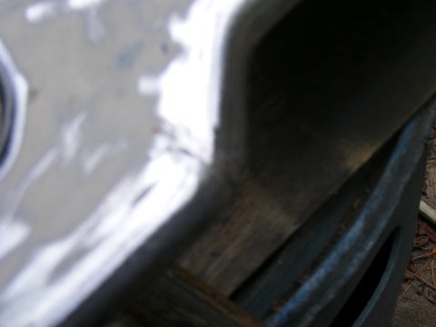 1978 Ford Bronco - A close-up view of a vehicle's metal body panel, a watermark for SUPERMOTORS.NET.