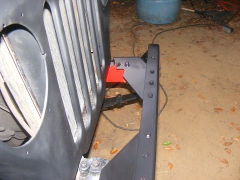 1978 Ford Bronco - Aftermarket bumper bracket installation on a vehicle's front end.