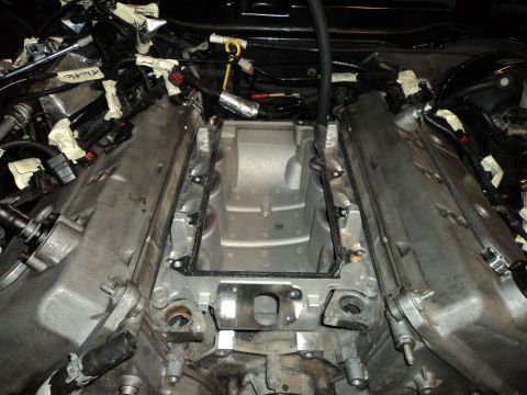 2004 Mercury Grand Marquis - Engine bay components are visible with the intake manifold removed, revealing wiring and gasket details.