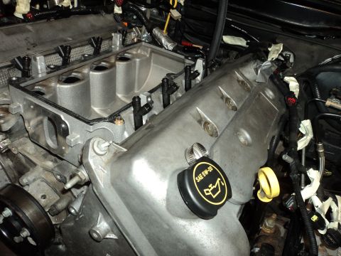 2004 Mercury Grand Marquis - Close-up view of an engine bay, showing intake manifold and fuel injectors.