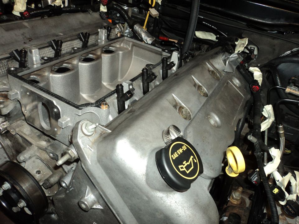 Engine bay with silver intake manifold and black fuel injectors